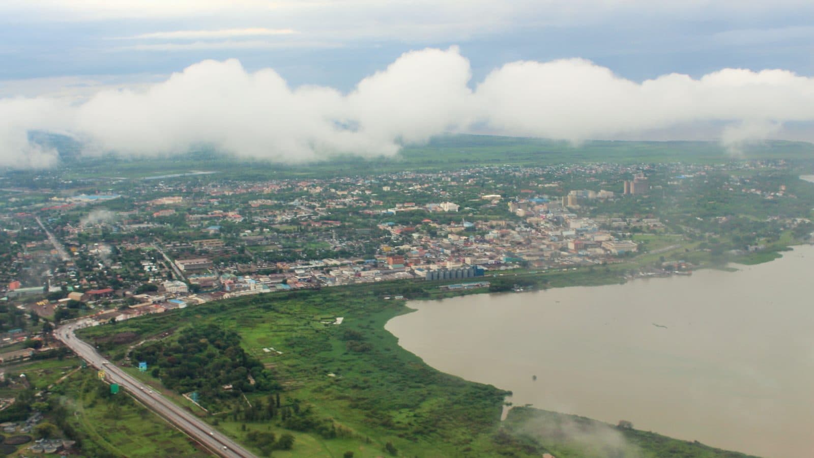 Elevated cityscape view of Kisumu showing the central business district and Lake Victoria in the background