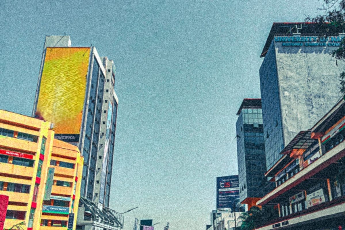 Street scene in uptown Kisumu showing tall commercial buildings lining the central business district